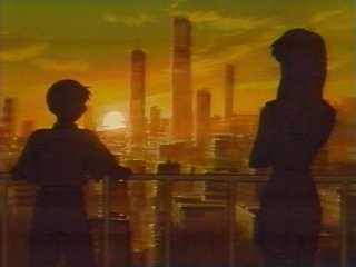 Shinji and Misato witness Shin Tokyo-3 rising from the hardened bunkers.